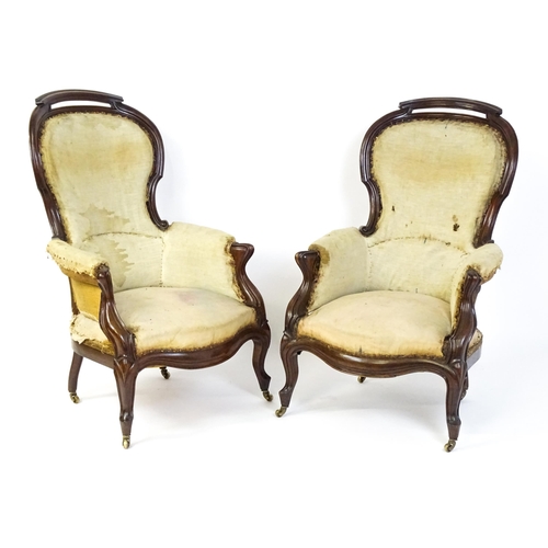 1690 - A pair of 19thC mahogany armchairs for re-upholstery, the chairs having spoon backs, manchettes and ... 