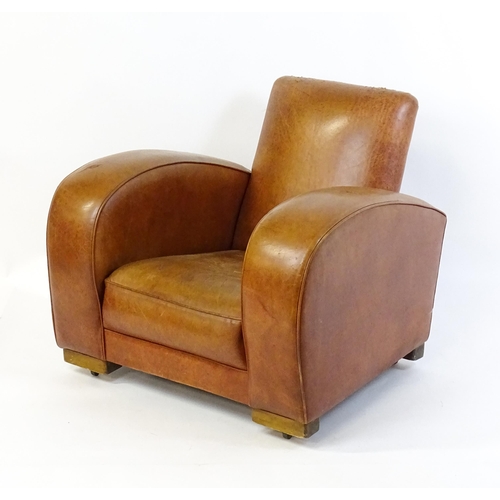 1707 - An early / mid 20thC Art Deco style leather club chair raised on block feet terminating in castors. ... 