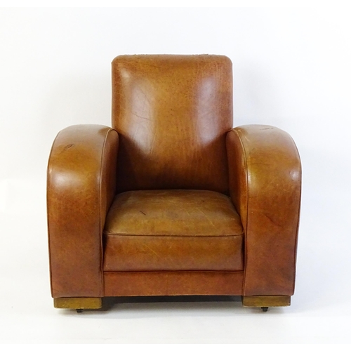 1707 - An early / mid 20thC Art Deco style leather club chair raised on block feet terminating in castors. ... 