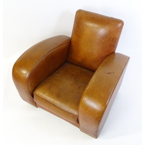 1707 - An early / mid 20thC Art Deco style leather club chair raised on block feet terminating in castors. ... 