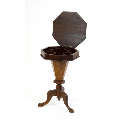 1713 - A 19thC trumpet shaped walnut sewing table with an octagonal hinged top inlaid with a games board, t... 