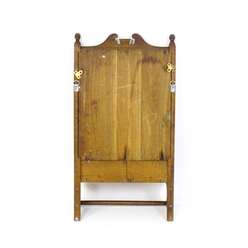 1747 - An early 20thC oak wall mirror / toilet mirror with an architectural swan neck pediment above a hing... 