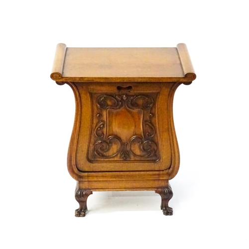 1753 - An early 20thC walnut side table with a hinged lid and a floral carved front raised on carved cabrio... 