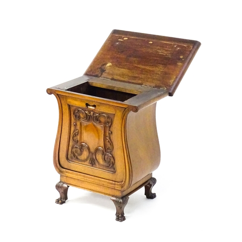 1753 - An early 20thC walnut side table with a hinged lid and a floral carved front raised on carved cabrio... 