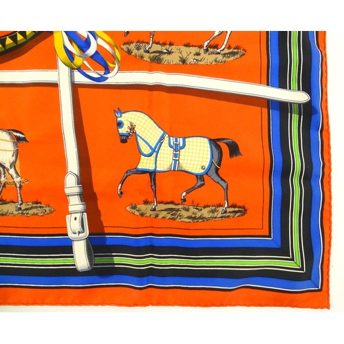 1090 - Vintage fashion / clothing: A boxed c1970's Hermes red silk 'Couvertures et Tenues' scarf by Jacques... 