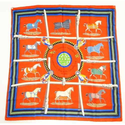 1090 - Vintage fashion / clothing: A boxed c1970's Hermes red silk 'Couvertures et Tenues' scarf by Jacques... 