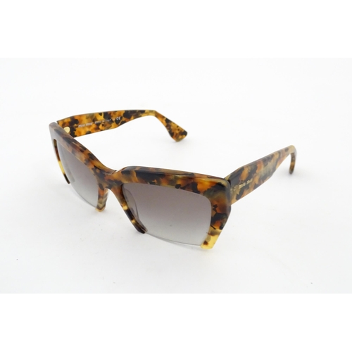 1094 - Vintage fashion / clothing: A pair of Miu Miu tortoiseshell rasoir cutoff rimless bottom sunglasses,... 