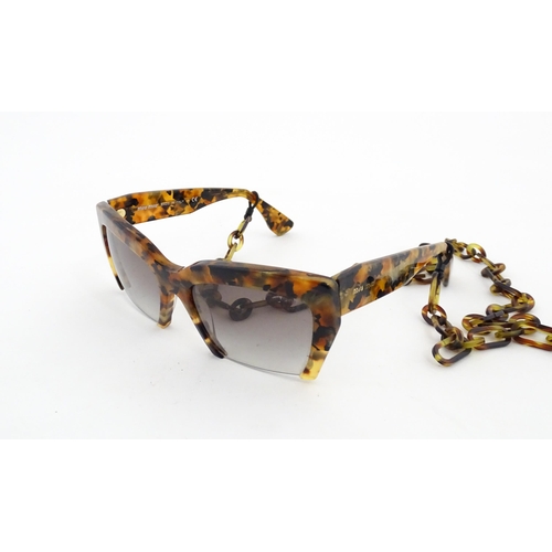 1094 - Vintage fashion / clothing: A pair of Miu Miu tortoiseshell rasoir cutoff rimless bottom sunglasses,... 