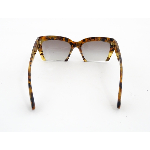 1094 - Vintage fashion / clothing: A pair of Miu Miu tortoiseshell rasoir cutoff rimless bottom sunglasses,... 