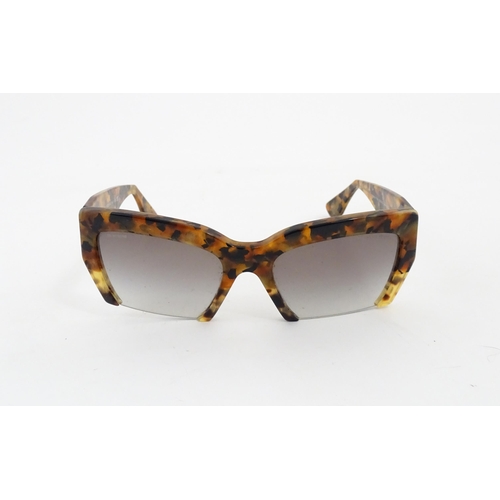 1094 - Vintage fashion / clothing: A pair of Miu Miu tortoiseshell rasoir cutoff rimless bottom sunglasses,... 