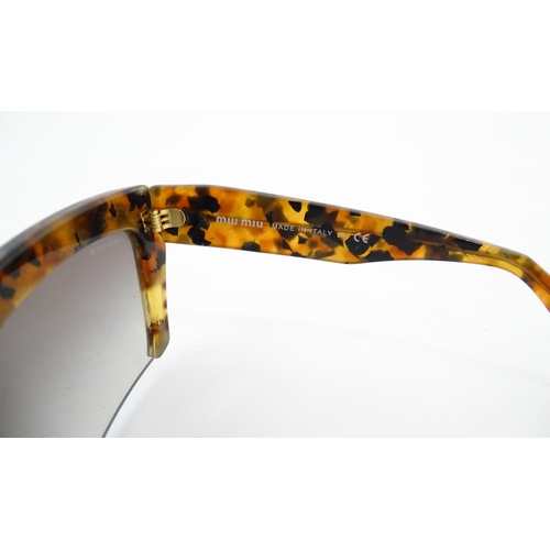 1094 - Vintage fashion / clothing: A pair of Miu Miu tortoiseshell rasoir cutoff rimless bottom sunglasses,... 