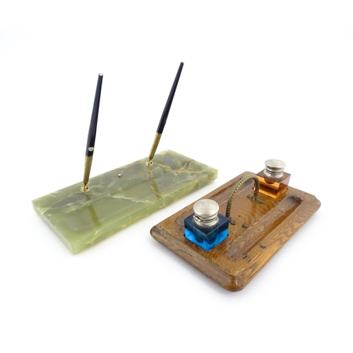 1210A - A Victorian oak standish with two coloured glass inkwells and two pen wells. Together with an onyx s... 