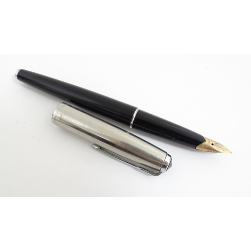 1220A - A quantity of fountain pens, comprising three Parker pens (including boxed Parker 51 model with 14k ... 