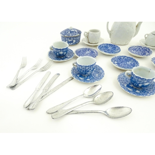 201 - A quantity of blue and white miniature tea wares to include milk jug, sugar bowl, cups and saucers. ... 