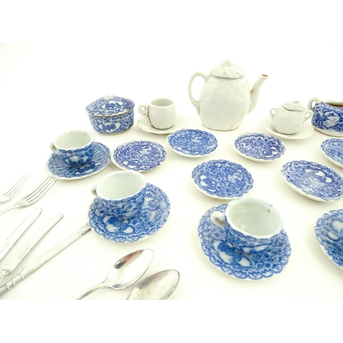 201 - A quantity of blue and white miniature tea wares to include milk jug, sugar bowl, cups and saucers. ... 