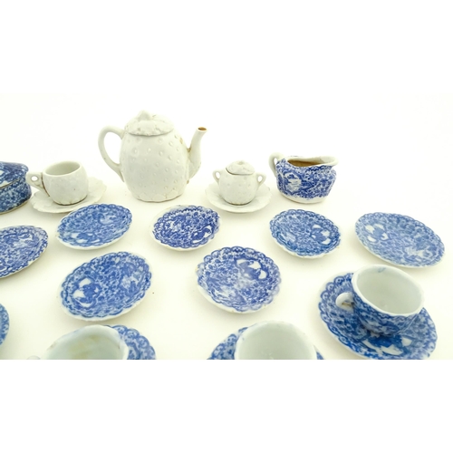 201 - A quantity of blue and white miniature tea wares to include milk jug, sugar bowl, cups and saucers. ... 