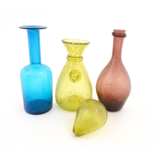 220A - Three items of glassware to include a turquoise glass bottle vase, a purple glass bottle vase and a ... 