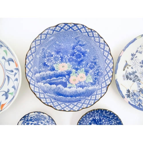 55A - Six assorted Japanese items to include plates decorated with flowers and birds, dishes with scrolled... 