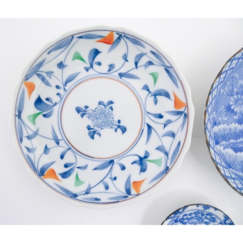 55A - Six assorted Japanese items to include plates decorated with flowers and birds, dishes with scrolled... 