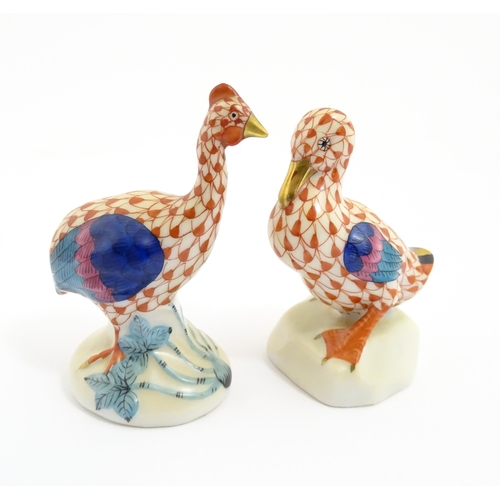 81 - Two Herend porcelain models of birds comprising guinea fowl, and duck, both with fishnet decoration ... 