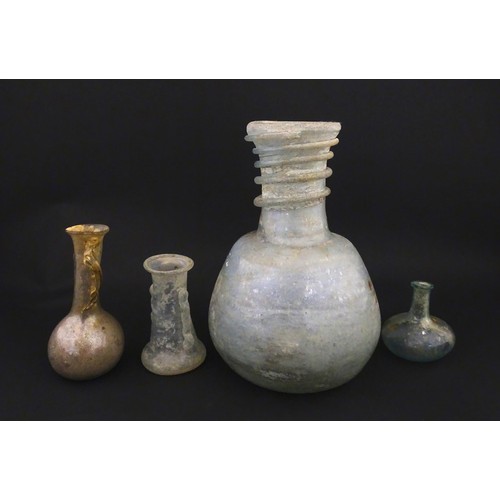 217A - Four glass vases in the Roman style with iridescent finish, some with trail detail. Largest approx. ... 