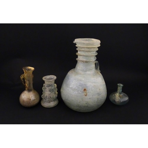 217A - Four glass vases in the Roman style with iridescent finish, some with trail detail. Largest approx. ... 