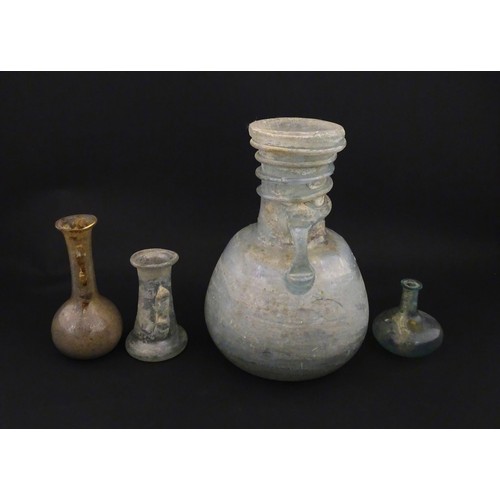 217A - Four glass vases in the Roman style with iridescent finish, some with trail detail. Largest approx. ... 