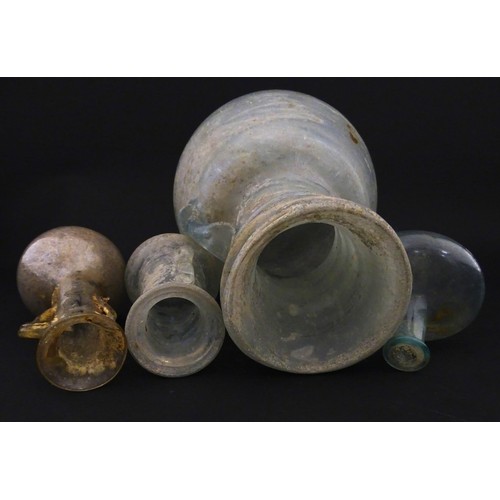 217A - Four glass vases in the Roman style with iridescent finish, some with trail detail. Largest approx. ... 