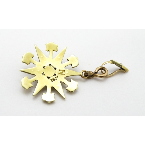 784 - A Victorian 15ct gold pendant of star form set with seed pearls, and engraved 'N' to reverse. Approx... 