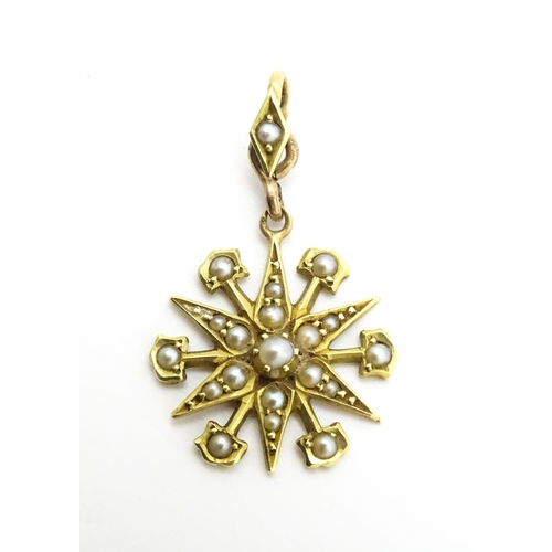 784 - A Victorian 15ct gold pendant of star form set with seed pearls, and engraved 'N' to reverse. Approx... 