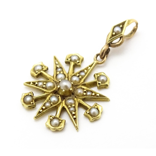 784 - A Victorian 15ct gold pendant of star form set with seed pearls, and engraved 'N' to reverse. Approx... 