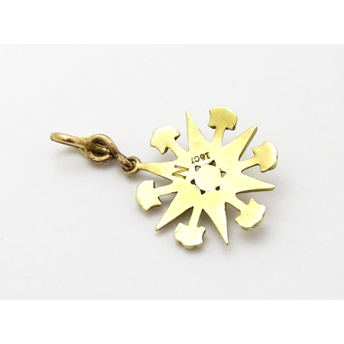 784 - A Victorian 15ct gold pendant of star form set with seed pearls, and engraved 'N' to reverse. Approx... 