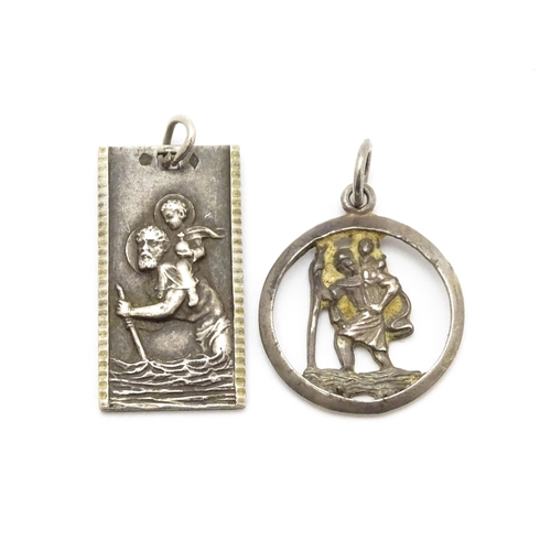 788 - A Continental silver pendant depicting St Christopher. Together with another. Largest approx. 1