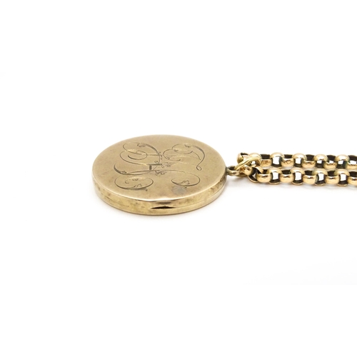 789 - A 9ct gold and yellow metal chain set with circular yellow metal pendant locket. Pendant approx. 1 1... 