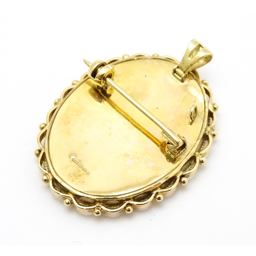 793 - A 9ct gold pendant / brooch with hand painted portrait miniature to centre set with diamonds and sig... 