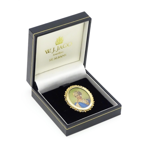 793 - A 9ct gold pendant / brooch with hand painted portrait miniature to centre set with diamonds and sig... 