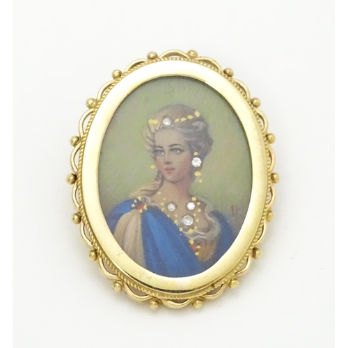 793 - A 9ct gold pendant / brooch with hand painted portrait miniature to centre set with diamonds and sig... 