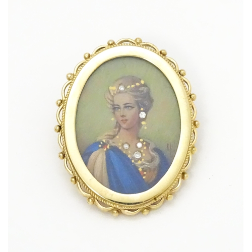 793 - A 9ct gold pendant / brooch with hand painted portrait miniature to centre set with diamonds and sig... 