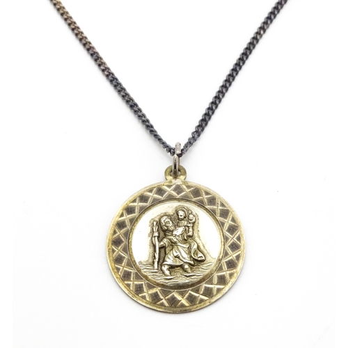 794 - A silver St. Christopher pendant on chain, the pendant marked GJ Ltd. for Georg Jensen Ltd. Chain ap... 