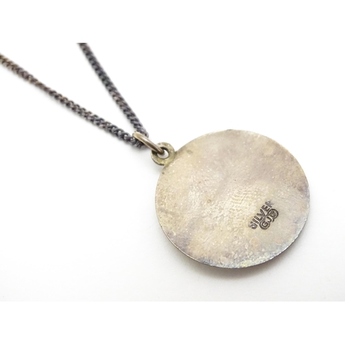 794 - A silver St. Christopher pendant on chain, the pendant marked GJ Ltd. for Georg Jensen Ltd. Chain ap... 