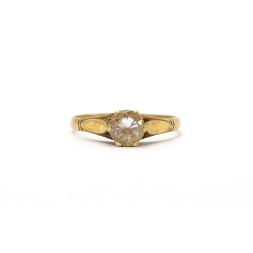 799 - A 9ct gold ring set with white stone solitaire. Ring size approx. N