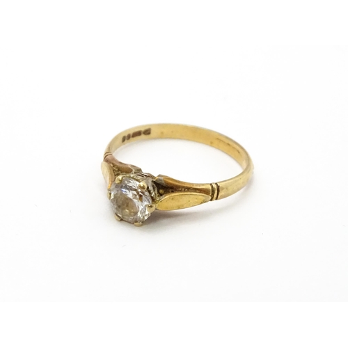 799 - A 9ct gold ring set with white stone solitaire. Ring size approx. N