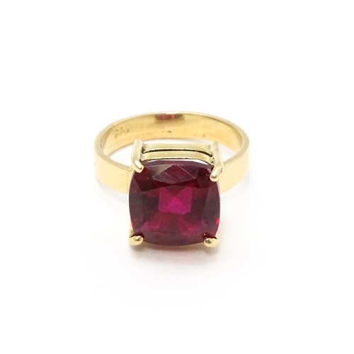 800 - A 9ct gold ring set with central ruby. Ring size approx. Q