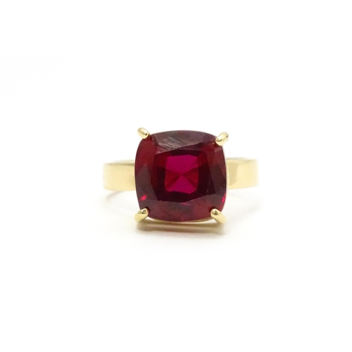 800 - A 9ct gold ring set with central ruby. Ring size approx. Q