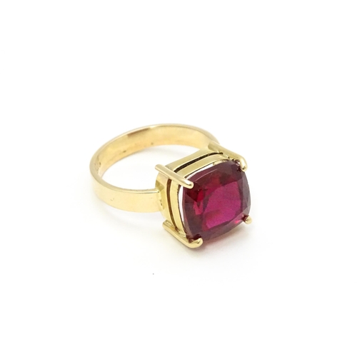 800 - A 9ct gold ring set with central ruby. Ring size approx. Q