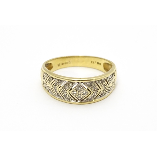 801 - A 14ct gold ring set with diamonds. Ring size approx. P 1/2