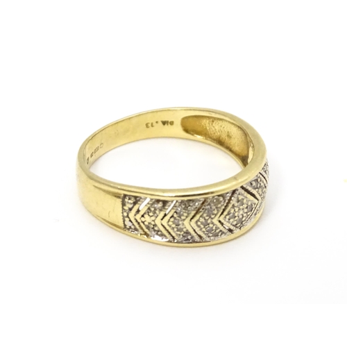 801 - A 14ct gold ring set with diamonds. Ring size approx. P 1/2