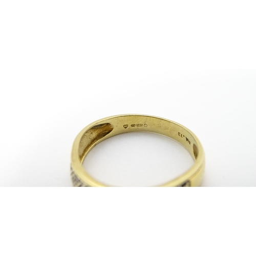 801 - A 14ct gold ring set with diamonds. Ring size approx. P 1/2