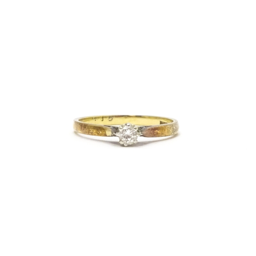 810 - A 9ct gold ring set with diamond solitaire. Ring size approx. L 1/2