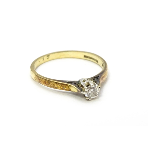 810 - A 9ct gold ring set with diamond solitaire. Ring size approx. L 1/2